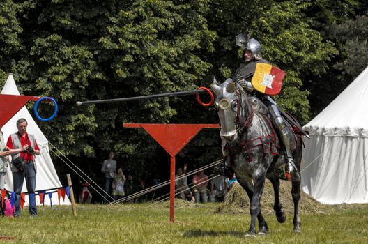 CHORZOW,POLAND, JUNE 9: Medieval knight on horseback showing their skills during a IV Convention of Christian Knighthood on June 9, 2013, in Chorzow