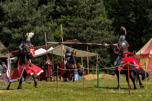 CHORZOW,POLAND, JUNE 9: Medieval knights jousting during a IV Convention of Christian Knighthood on June 9, 2013, in Chorzow