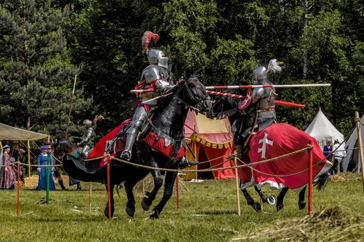 CHORZOW,POLAND, JUNE 9: Medieval knights jousting during a IV Convention of Christian Knighthood on June 9, 2013, in Chorzow