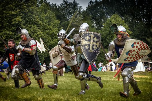 CHORZOW,POLAND, JUNE 9: Charge of the medieval knights during a IV Convention of Christian Knighthood on June 9, 2013, in Chorzow