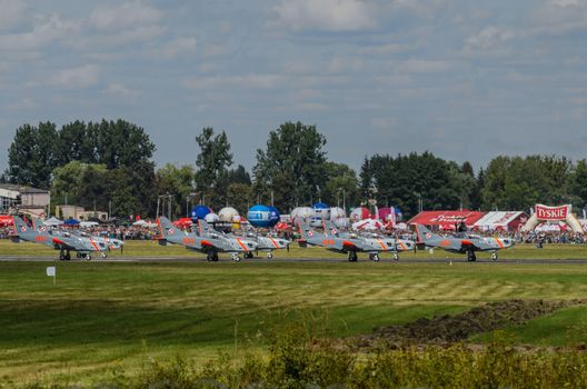 RADOM, POLAND - AUGUST 25: Orlik aerobatic display team during Air Show 2013 event on August 25, 2013 in Radom, Poland