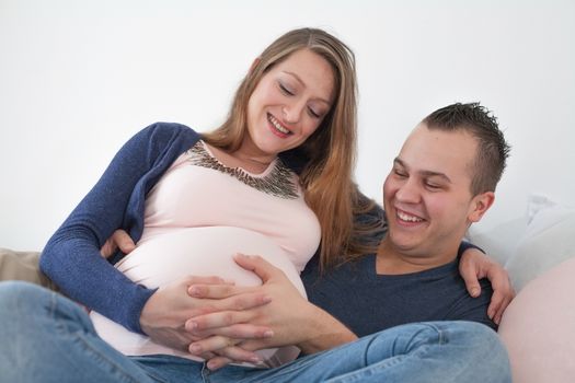 Young pregnant couple is waiting for their little girl