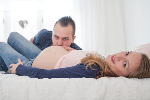 Young pregnant couple is waiting for their little girl