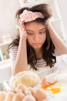 Frustrated Young woman making dough