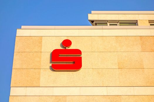 Stuttgart, Germany - November 1, 2013: Modern building facade with logo of the german banks named Sparkasse. The sign is famous symbol of recognition of the savings banks in Germany.