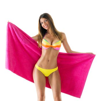 Beautiful young woman smiling and posing in bikini with pink towel. 