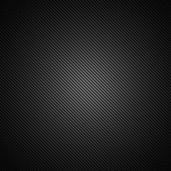 A realistic dark carbon fiber weave background or texture