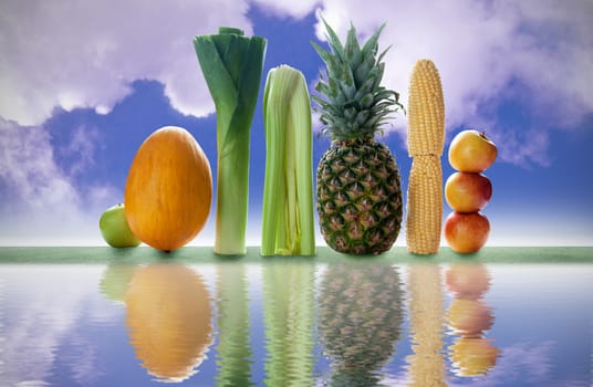 Tall fruits and vegetables over a lake