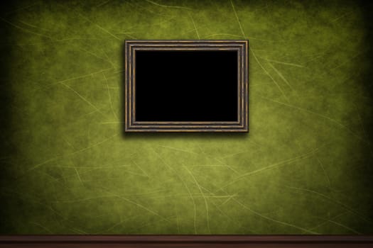 Old wooden frame on green retro grunge wall