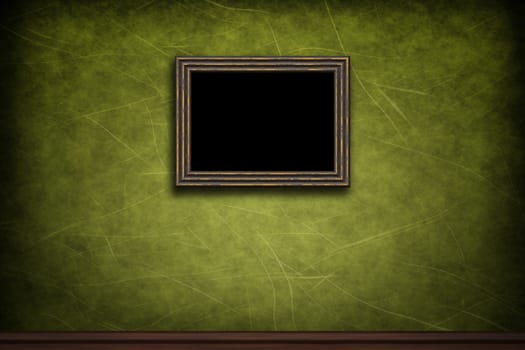 Old wooden frame on green retro grunge wall