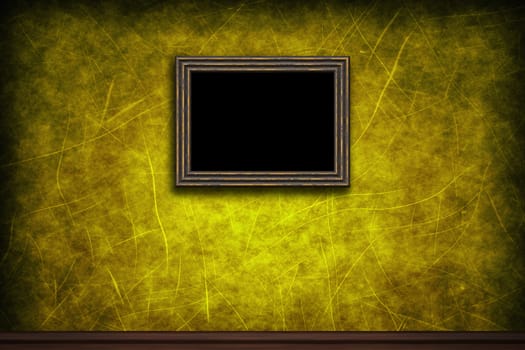 Old wooden frame on yellow retro grunge wall