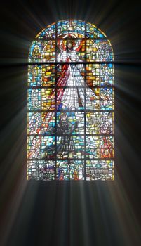 Biblical stained glass with rays of light shining through