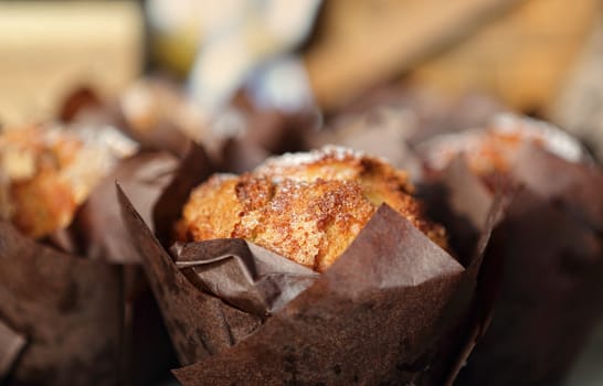 Fresh baked muffins lightly dusted with icing sugar powder