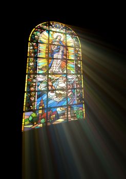 Biblical stained glass with rays of light shining through