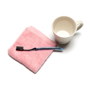 tooth brush and towel with mug isolated on white background