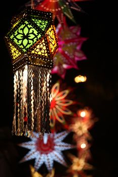 A traditional Diwali lantern on the backdrop of other lanters during the diwali festival in India.