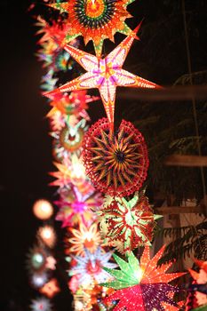 A tower of beautiful colorful lanters lit up in a tower formation on the occasion of Diwali / Christmas vacation in India.