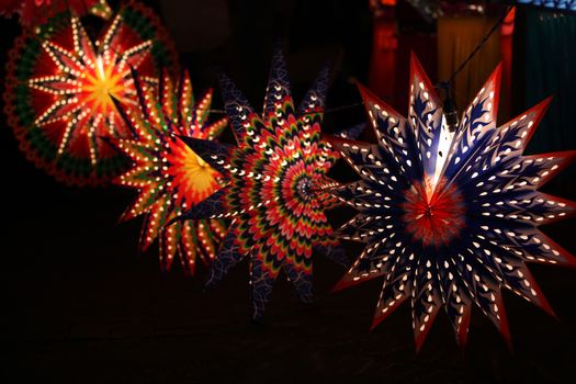 Beautiful star shaped lanterns lit up on occasion of Diwali / Christmas festival in India