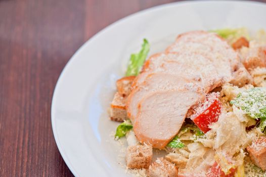 Chicken ceasar salad closeup photo