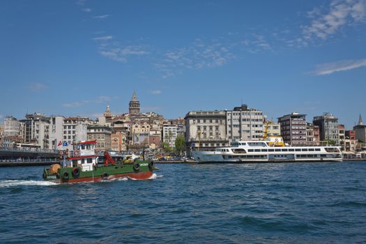 ISTANBUL, TURKEY – APRIL 27: Boat activity on the with the Galata Tower and neighborhood behind prior to Anzac Day on April 27, 2012 in Istanbul, Turkey. 