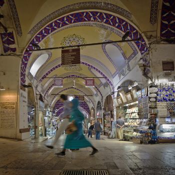 ISTANBUL, TURKEY – APRIL 26: Couple walking in the Grand Bazaar in Istanbul prior to Anzac Day on April 26, 2012 in Istanbul, Turkey. 