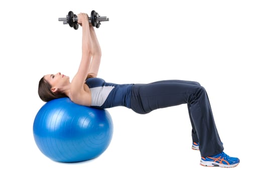 Young woman shows finishing position of Fitball Dumbbell Chest Fly's Workout, isolated on white