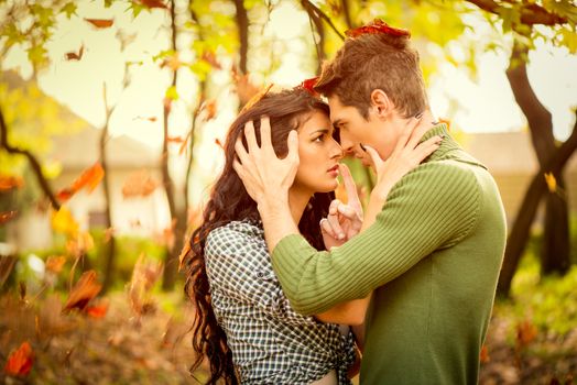 Close-up of a young heterosexual couple in love at the moment before or after the kiss.