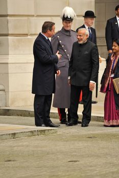 UK, London: Indian Prime Minister Narendra Modi laughs with British Prime Minister David Cameron on Whitehall shortly after his arrival in London on November 12, 2015. Modi's three-day visit marks the first by an Indian Prime Minister in more than a decade.