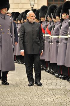 UK, London: Indian Prime Minister Narendra Modi greets an honor guard on Whitehall shortly after his arrival in London on November 12, 2015. Modi's three-day visit marks the first by an Indian Prime Minister in more than a decade.