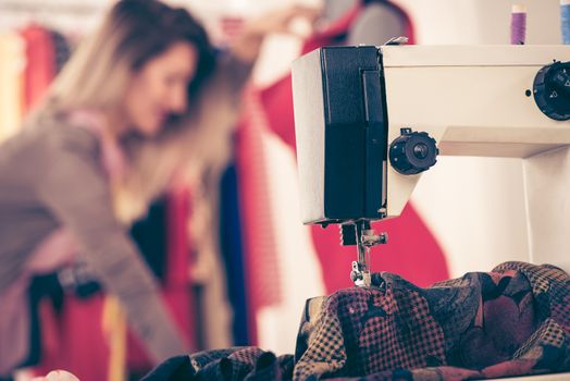 Close-up of a sewing machine with a material that sew.