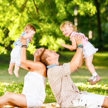 Beautiful family playing in the park