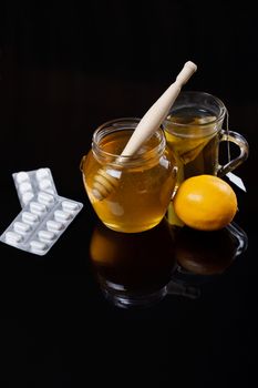 Honey, tea and medicine, Flue concept, dark background