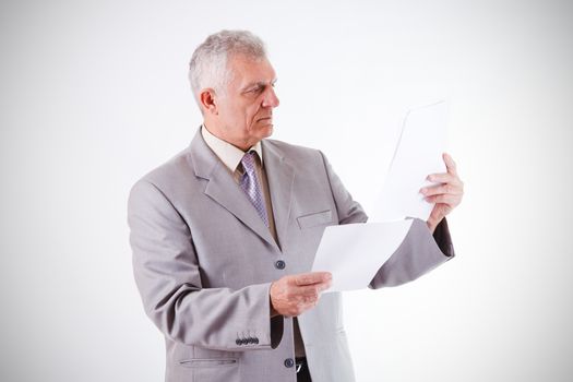 Senior Businessman looking at documents