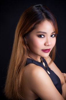 Portrait of young Asian girl - black dress close-up