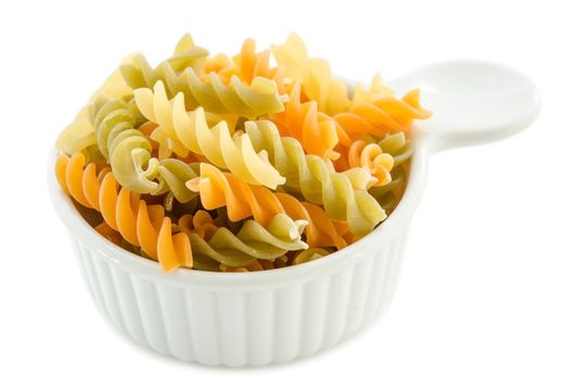 dried italian pasta (macaroni) in white bowl on white background.