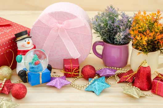 Christmas decoration with presents on wood background.