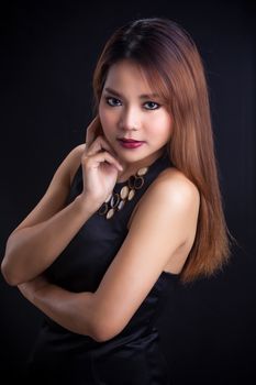 Portrait of young Asian girl - black dress