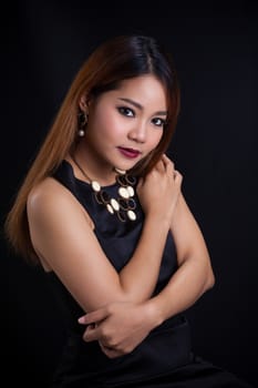 Portrait of young Asian girl - black dress