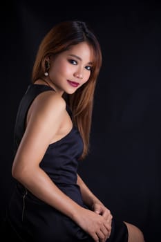 Portrait of young Asian girl - black dress