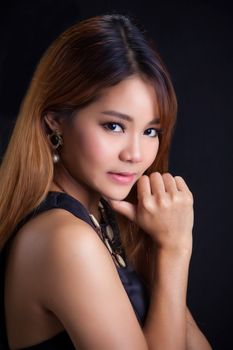 Portrait of young Asian girl - black dress close-up