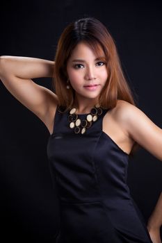 Portrait of young Asian girl - black dress