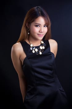 Portrait of young Asian girl - black dress