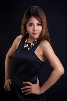 Portrait of young Asian girl - black dress