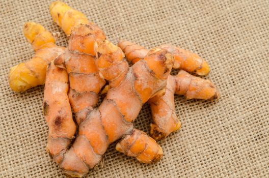 Turmeric on sack background.