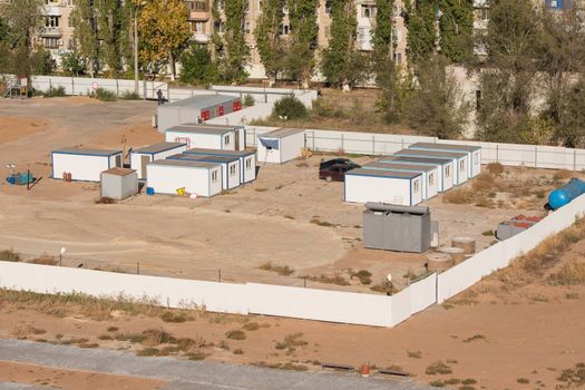 Volgograd, Russia - October 13, 2015: Aerial view of the fenced area on which the construction of a new multi-storey residential house