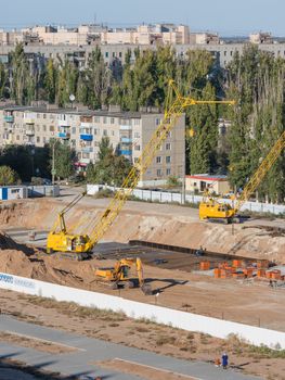 Volgograd, Russia - October 13, 2015: Aerial view of the fenced area on which the construction of a new multi-storey residential house
