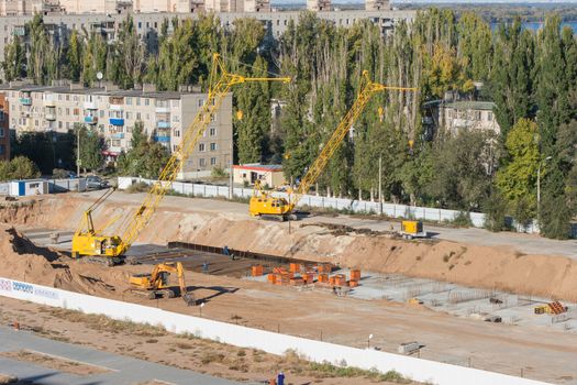 Volgograd, Russia - October 13, 2015: Aerial view of the fenced area on which the construction of a new multi-storey residential house
