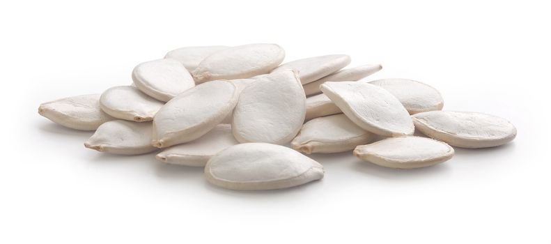 Handful of white pumpkin's seeds on the white background