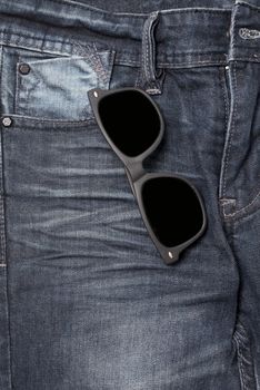 sunglasses on jean pants
