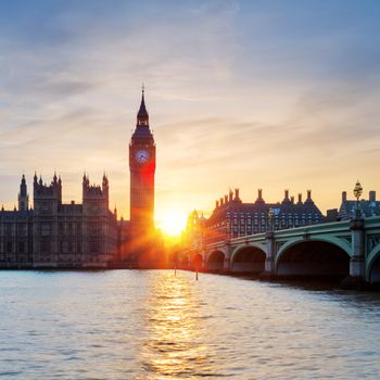 View of famous Big Ben clock tower in London at sunset, UK.